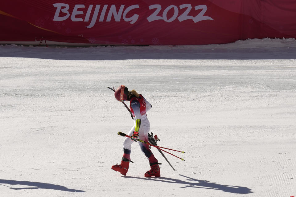 FILE - Mikaela Shiffrin of the United States leaves the finish area after racing in a semifinal of the mixed team parallel skiing event at the 2022 Winter Olympics, Sunday, Feb. 20, 2022, in the Yanqing district of Beijing. The dearth of candidates to host the Winter Olympics amid spiraling venue costs could force the IOC to resort to lining up a list of fixed, rotating hosts. A highly theoretical list could include Salt Lake City and Vancouver in North America, Pyeongchang in Asia and places like Switzerland, Italy and Scandinavia in Europe. (AP Photo/Luca Bruno, File)
