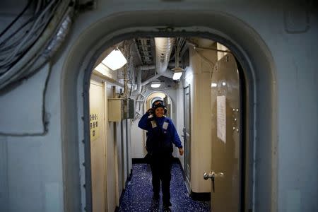 A US Navy sailor walks on the USS Harry S. Truman aircraft carrier in the eastern Mediterranean Sea, June 14, 2016. REUTERS/Baz Ratner