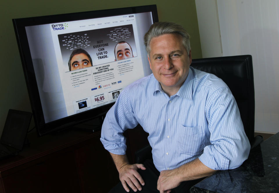 In this Sept. 12, 2012, photo, Joe Fox, CEO of Ditto Trade, poses in his offices in Los Angeles. Ditto Trade is a new online brokerage firm where one can attach their stock portfolio to that of person they trust, so that when they make a trade, so will you. (AP Photo/Reed Saxon)