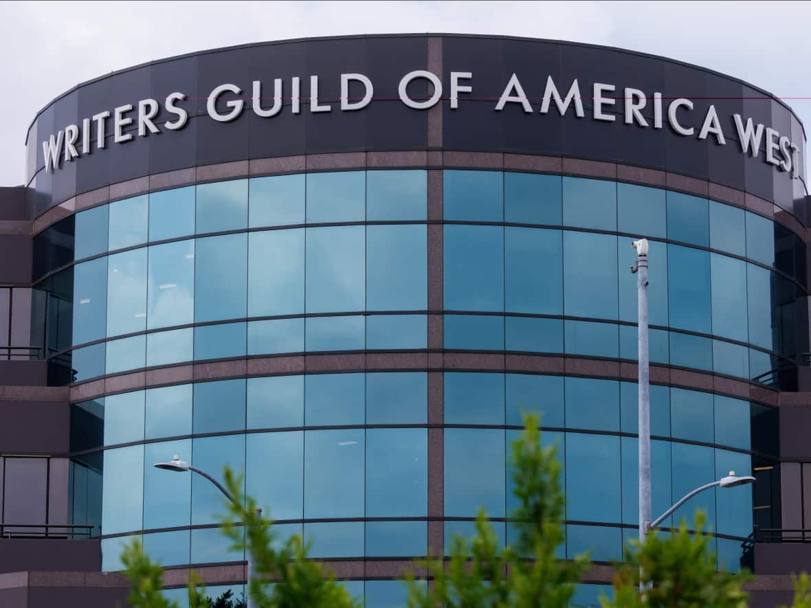 The Writers Guild of America West offices are shown in Los Angeles on April 25. Hollywood film and TV writers voted overwhelmingly earlier this month to authorize a strike if their union fails to reach a deal by May 1. The WGA is in talks with the Alliance of Motion Picture and Television Producers (Mike Blake/Reuters - image credit)