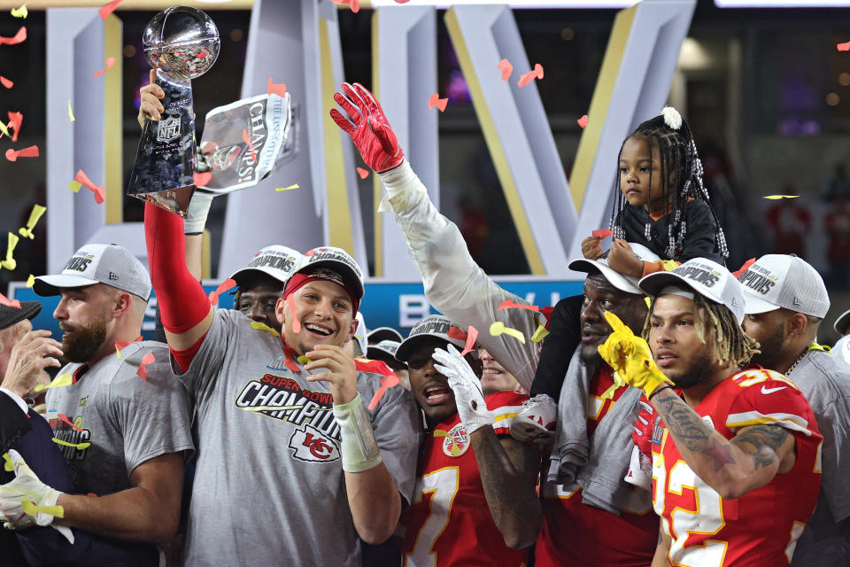 Patrick Mahomes raises the Vince Lombardi Trophy after defeating the San Francisco 49ers 31-20 in Super Bowl LIV. (Photo by Jamie Squire/Getty Images)