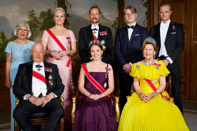 <p>LISE ASERUD/NTB/AFP via Getty</p> Princess Ingrid Alexandra (front row, center) poses with family at her 18th birthday gala dinner in Oslo on June 17, 2022.