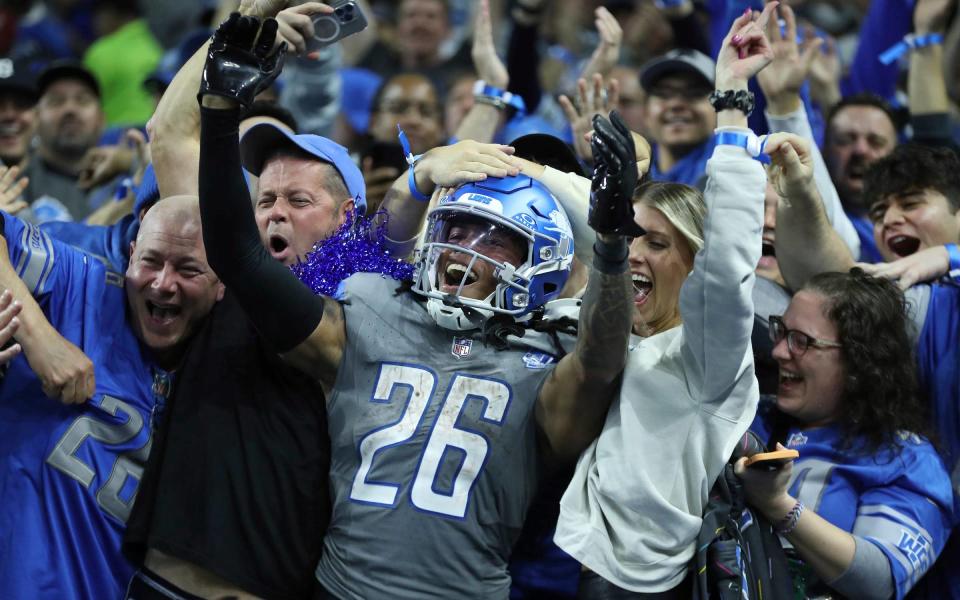 Detroit Lions running back Jahmyr Gibbs celebrates his touchdown with Lions fans against the <a class="link " href="https://sports.yahoo.com/nfl/teams/las-vegas/" data-i13n="sec:content-canvas;subsec:anchor_text;elm:context_link" data-ylk="slk:Las Vegas Raiders;sec:content-canvas;subsec:anchor_text;elm:context_link;itc:0">Las Vegas Raiders</a> during the second half at Ford Field, Monday, Oct. 30, 2023.