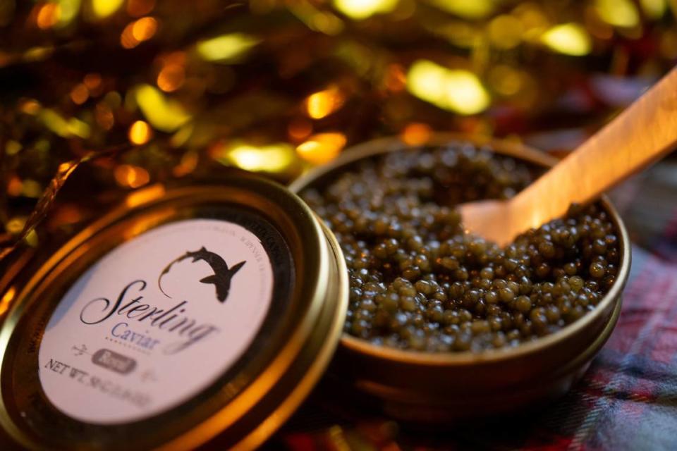 An open tin of Sterling Caviar is ready to provide caviar “bumps” – dollops of the sturgeon roe placed on the space between the thumb and index finger – at the Butterscotch Den on Dec. 12 in Sacramento’s Oak Park neighborhood.