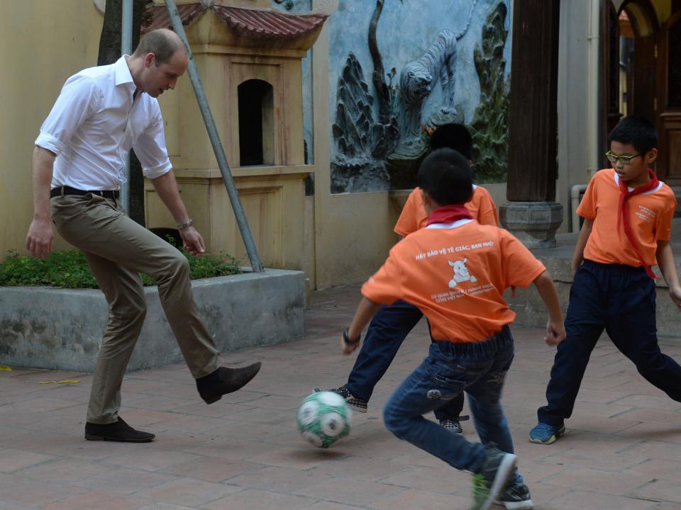 Prince William plays soccer with students