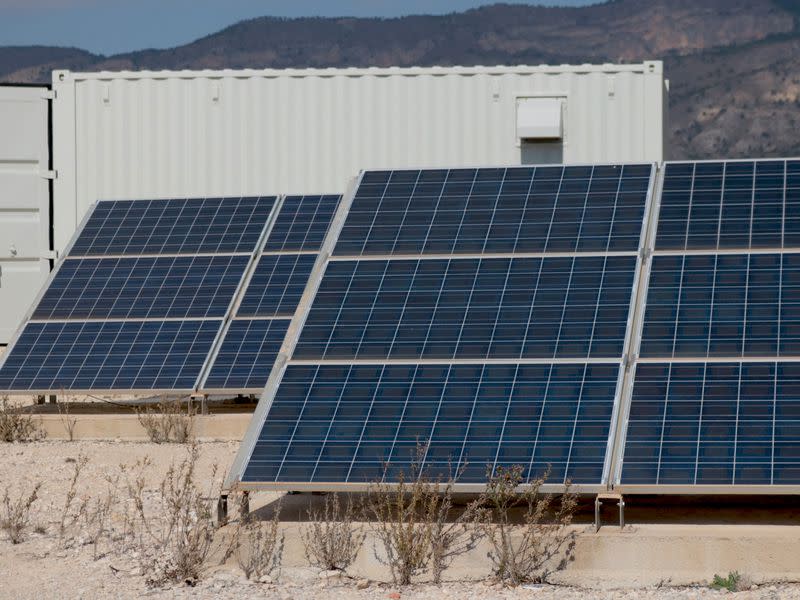 Solar panels power the mining rigs in a container. (Eliza Gkritsi)