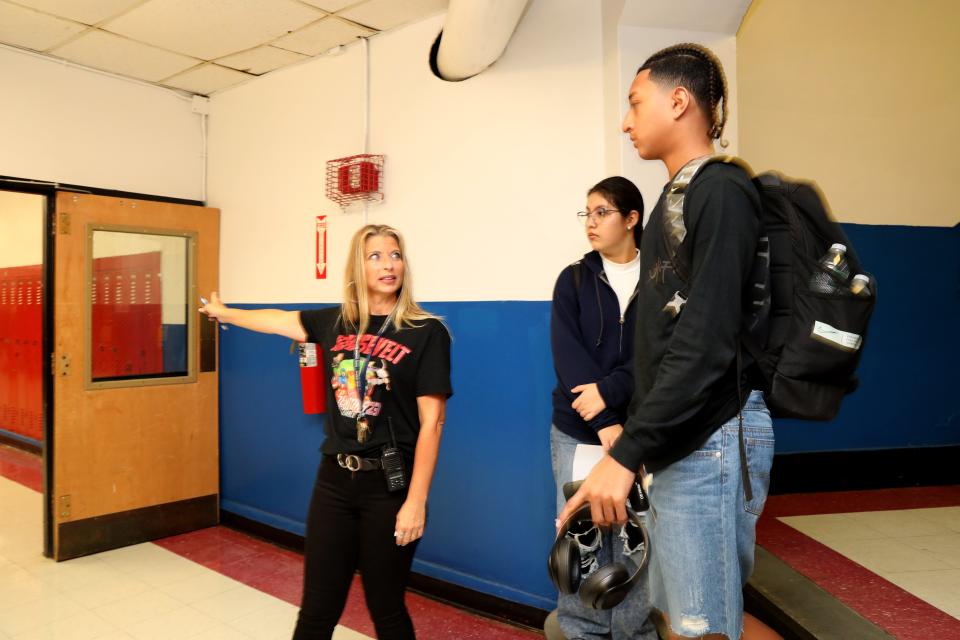 Mary Ryan, a classroom aide, helps students find their classrooms on the first day of school at Roosevelt High School Ð Early College Studies Sept. 7, 2023.