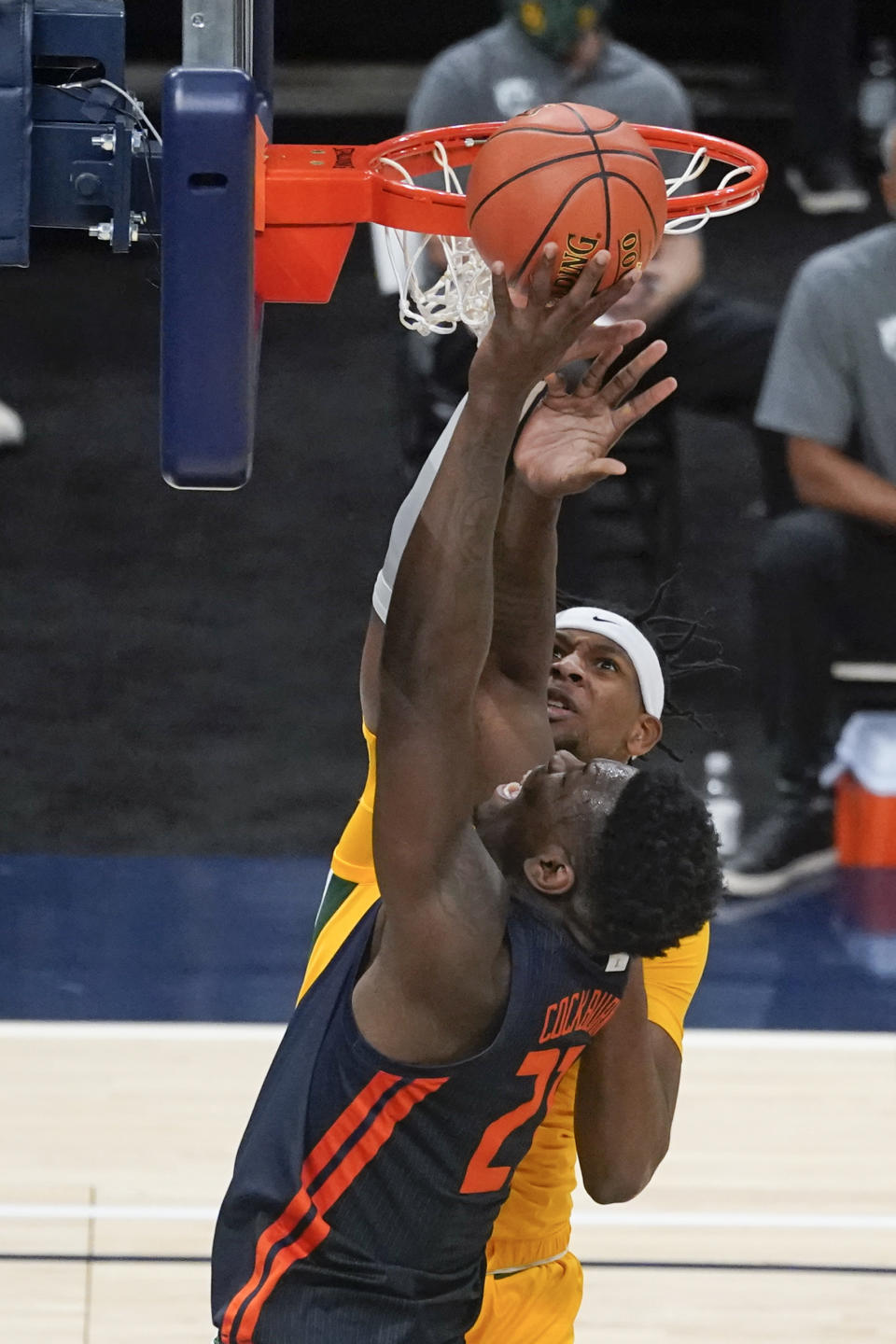 Illinois' Kofi Cockburn (21) puts up a shot against Baylor's Flo Thamba (0) during the first half of an NCAA college basketball game, Wednesday, Dec. 2, 2020, in Indianapolis. (AP Photo/Darron Cummings)