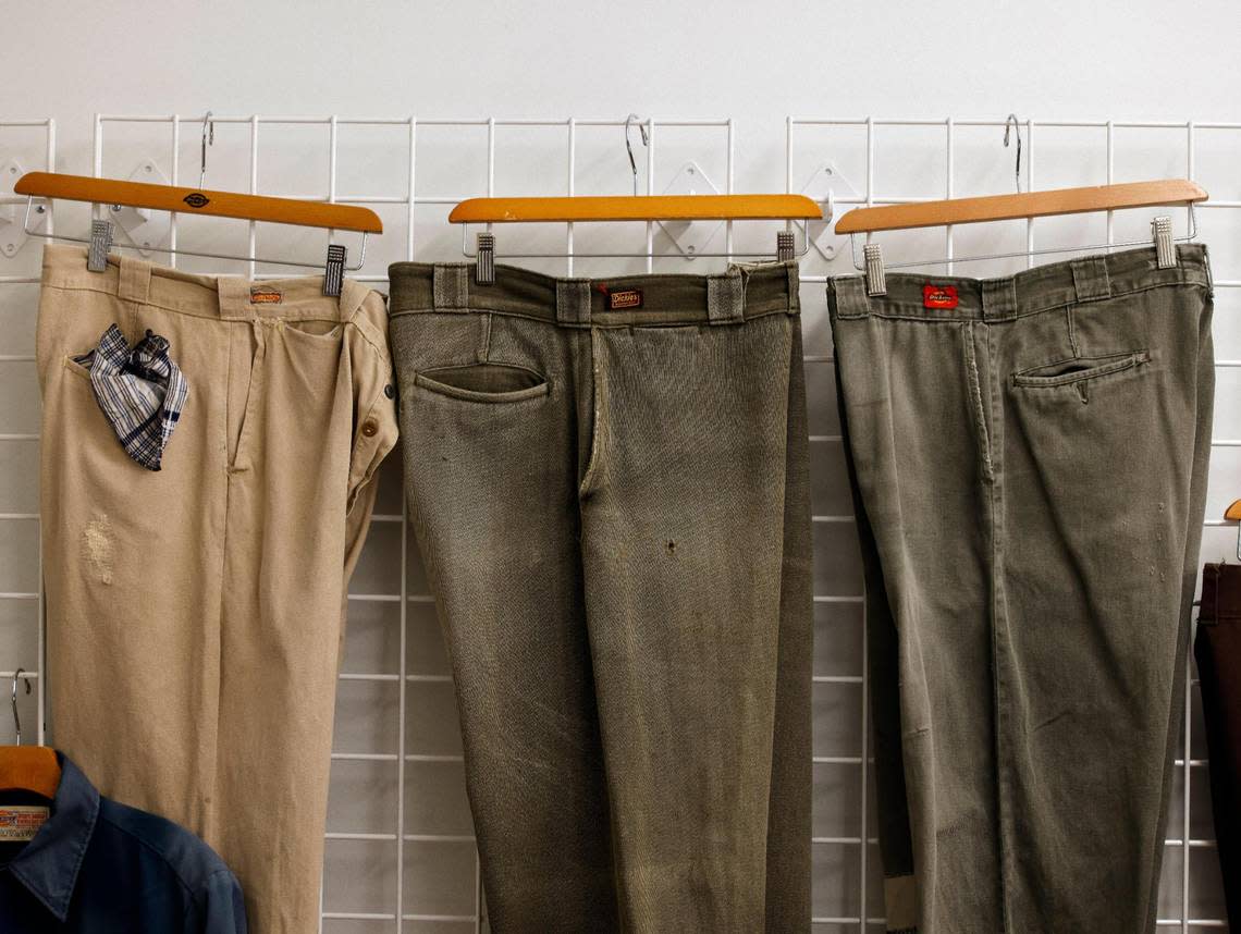 Work pants from the 30’s, 40’s and 50’s hang on a wall in the archive room at Dickies offices in downtown Fort Worth Texas, Thursday Mar. 28, 2024. The 102 year old work apparel company recently relocated to downtown Fort Worth. (Special to the Star-Telegram Bob Booth) Bob Booth/Special to the Star-Telegram Bob Booth