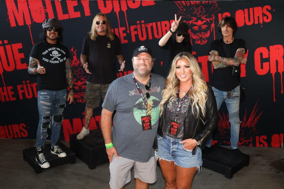 Joe and Lindsey Weaver of New York pose in front of Motley Crue. The photo was part of their VIP package, but Joe Weaver says the experience the couple had was far from what was promised.