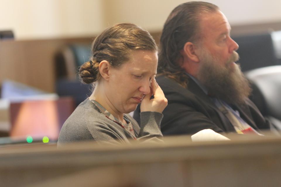 Alexis Murray Smith wipes her eye during her child abuse trial stemming from the death of Murray Smith's 12-year-old son of a fentanyl overdose, Sept. 14, 2023 in Eddy County District Court.
