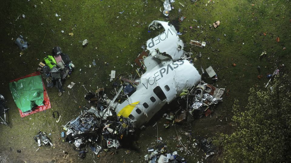 Plane debris can be seen at the impact site in Vinhedo, Sao Paulo state, Brazil, early on Saturday. - Andre Penner/AP