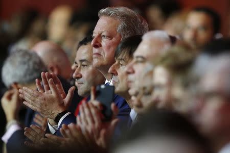 Al Gore (C), former U.S. Vice President and Climate Reality Project Chairman, and French environmentalist Nicolas Hulot sit together as they attend the World Climate Change Conference 2015 (COP21) at Le Bourget, near Paris, France, December 12, 2015. REUTERS/Stephane Mahe