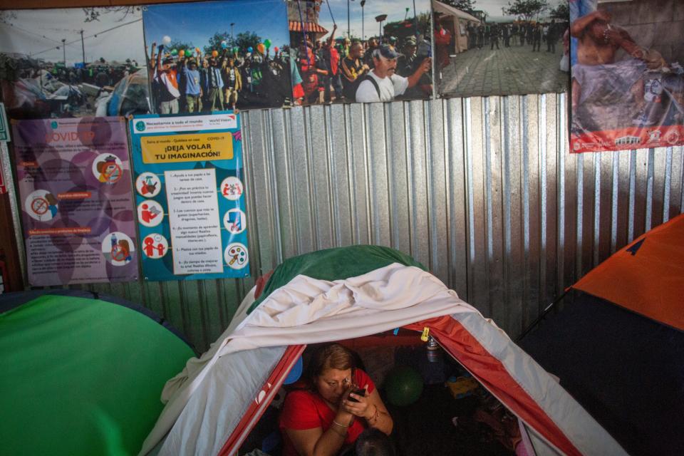 A migrant is photographed at a Tijuana migrant shelter on Feb. 9, 2021. Many migrants are hopeful that they can seek asylum in the U.S.