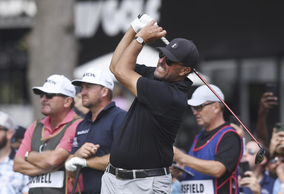 Phil Mickelson watches the flight of his tee shot on the first hole during the second round of the LIV Golf Invitational-Chicago tournament Saturday, Sept. 17, 2022, in Sugar Grove, Ill. (Joe Lewnard/Daily Herald via AP)