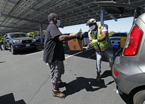 <span class="caption">A community drive-thru distribution centre in Vallejo, California in June 2020. </span> <span class="attribution"><span class="source">John G. Mabanglo/EPA</span></span>