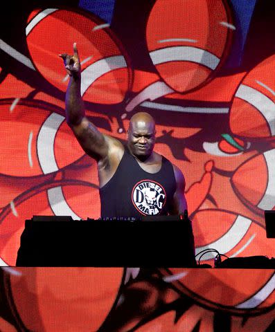 <p>Gerardo Mora/Getty</p> Shaquille O'Neal performs as DJ Diesel at The SHAQ Bowl