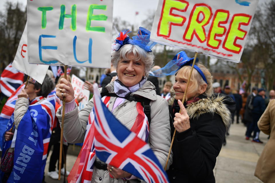 Pro Brexit supporters hold placards making their feelings clear