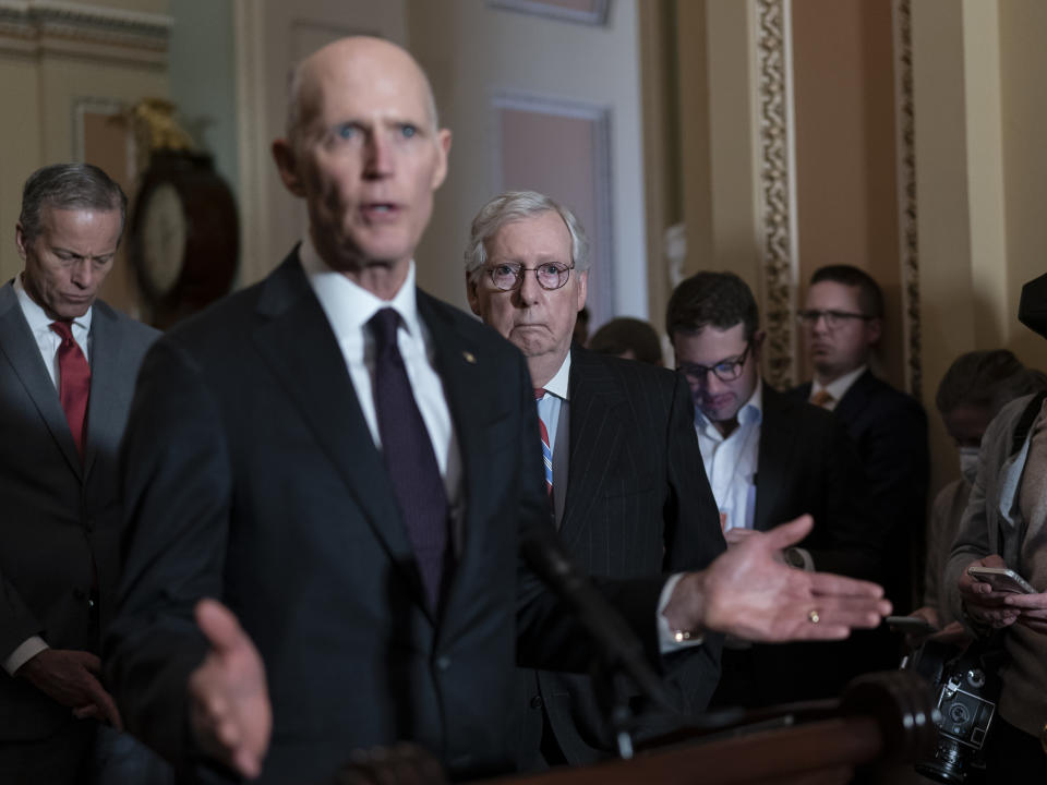 FILE — Sen. Rick Scott, R-Fla., speaks as Senate Minority Leader Mitch McConnell, R-Ky., listens at right during a news conference at the Capitol in Washington, March 8, 2022. Following the 2022 midterm elections, Scott, an ally of former President Donald Trump, is mounting a long-shot bid to unseat McConnell from his longtime position as Senate Republican leader. (AP Photo/J. Scott Applewhite, File)