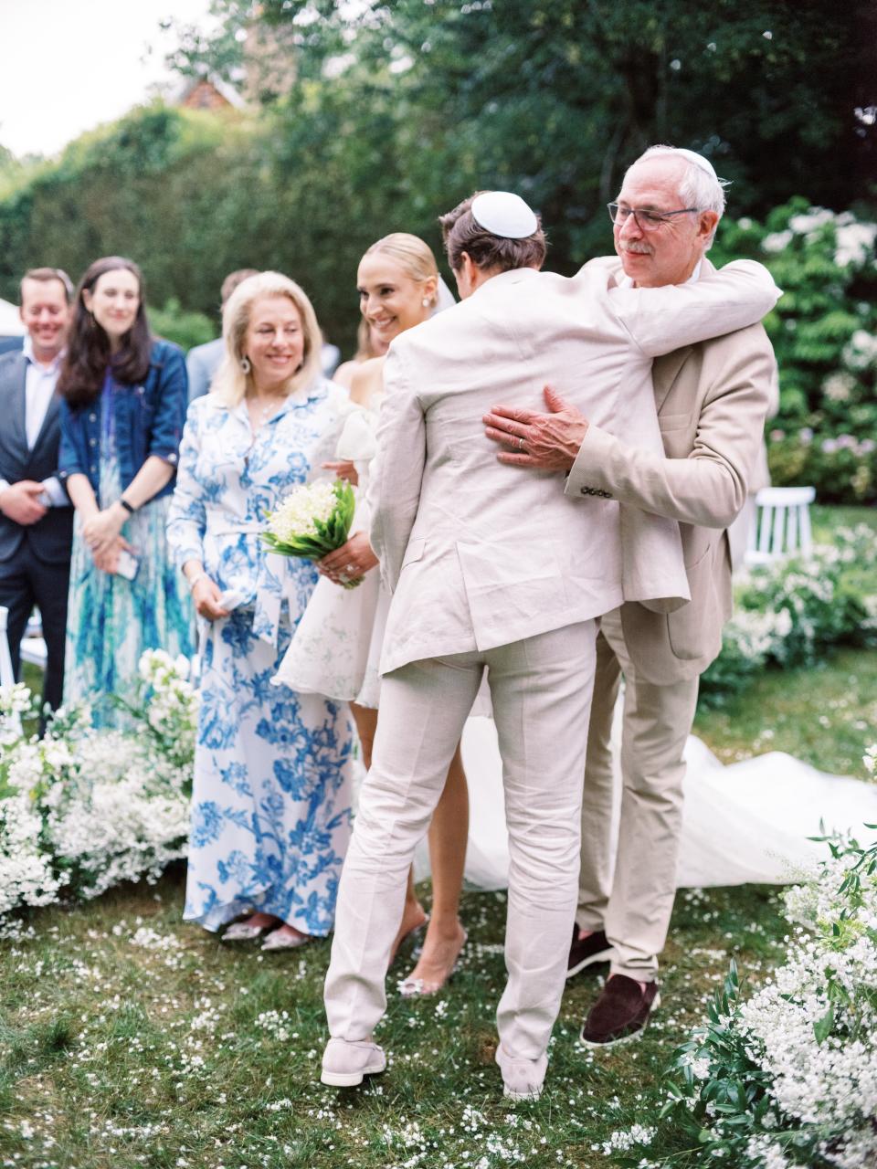 The Bride and Groom Said Their Vows Beneath a Floral Chuppah at This Hamptons Backyard Wedding