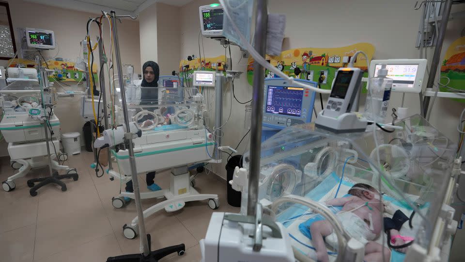 A Palestinian doctor treats a prematurely born baby at Al Aqsa Hospital in Deir el-Balah, Gaza, on October 22, 2023. - Adel Hana/AP