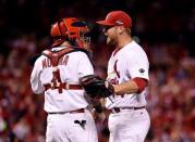 Oct 9, 2015; St. Louis, MO, USA; St. Louis Cardinals relief pitcher Trevor Rosenthal (44) celebrates with catcher Yadier Molina (4) after defeating the Chicago Cubs in game one of the NLDS at Busch Stadium. Mandatory Credit: Scott Rovak-USA TODAY Sports