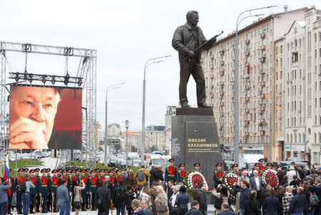 People gather for the opening ceremony of a monument to Mikhail Kalashnikov, the Russian designer of the AK-47 assault rifle, in Moscow, Russia September 19, 2017. REUTERS/Sergei Karpukhin