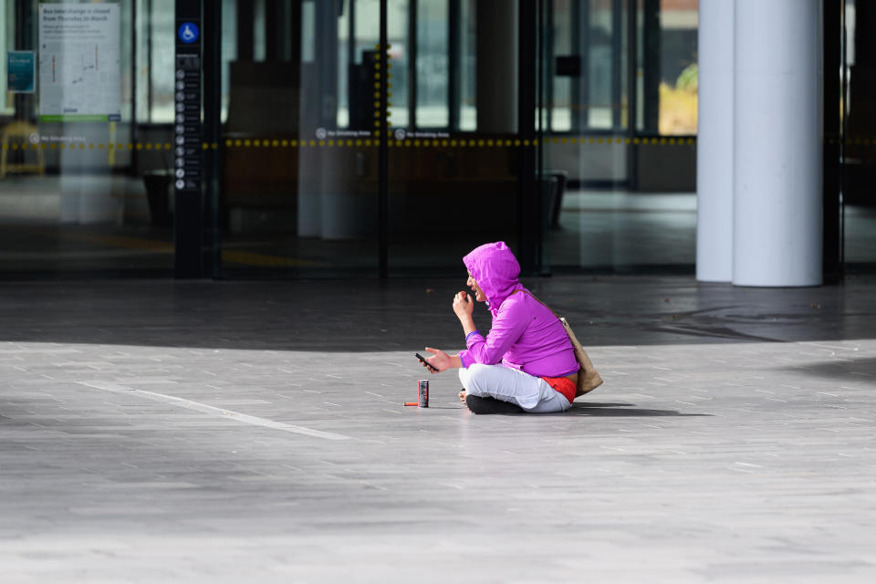 A homeless woman on March 26 in Christchurch, New Zealand. (Photo: Kai Schwoerer via Getty Images)