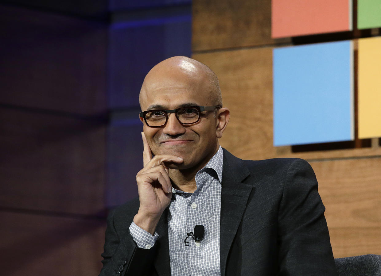 FILE - In this Wednesday, Nov. 30, 2016, file photo, Microsoft CEO Satya Nadella listens to a question at the annual Microsoft shareholders meeting in Bellevue, Wash. Nadella has written an autobiography recounting his efforts to transform the technology company with a focus on empathy and changing its workplace culture. The book, “Hit Refresh,” also reveals some personal challenges, such as his risky move to switch his green card to a temporary work visa in the 1990s so that his wife could join him in the United States. (AP Photo/Elaine Thompson, File)