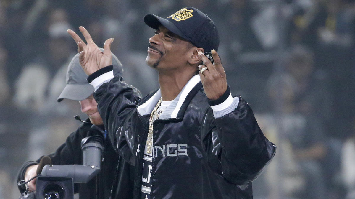 Rapper Snoop Dogg attends an NHL hockey game between Los Angeles