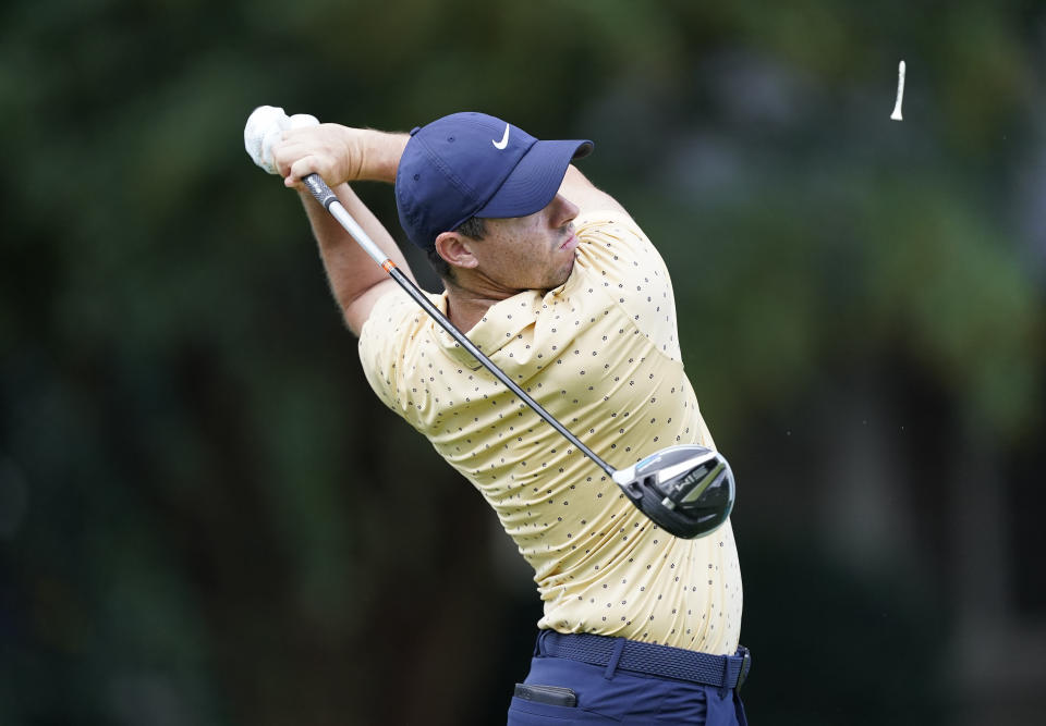 Rory McIlroy, hits his first tee shot during the first round of the Tour Championship golf tournament at East Lake Golf Club in Atlanta, Friday, Sept. 4, 2020. (AP Photo/John Bazemore)