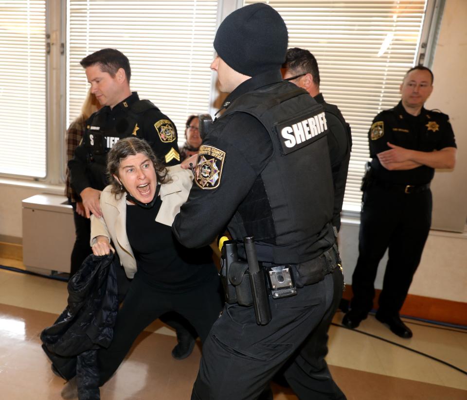 Protesters are removed as Rockland County Executive Ed Day delivers the State of the County address at the Rockland County Health Complex in Pomona, March 26, 2024.