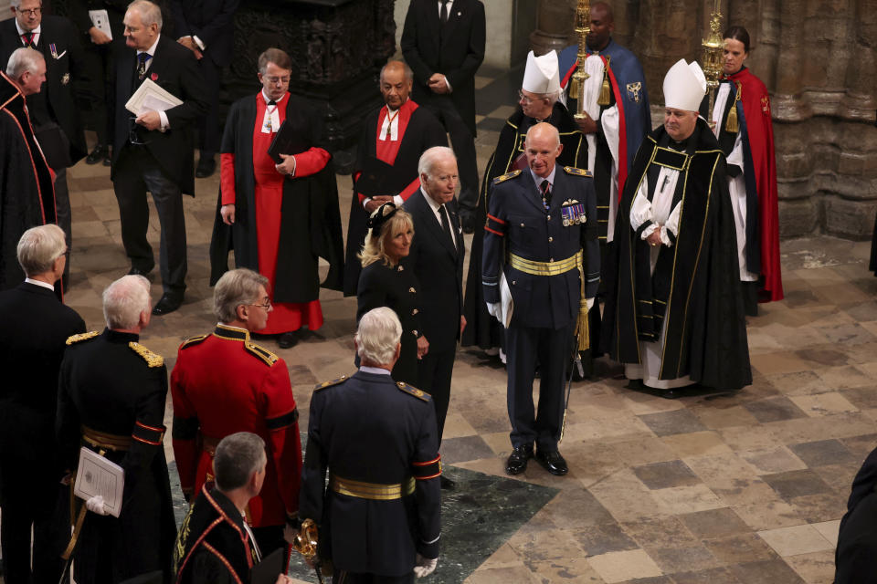 U.S. President Joe Biden and first lady Jill Biden arrive at the Westminster Abbey on the day of Queen Elizabeth II funeral, in London Monday, Sept. 19, 2022. (Phil Noble/Pool Photo via AP)