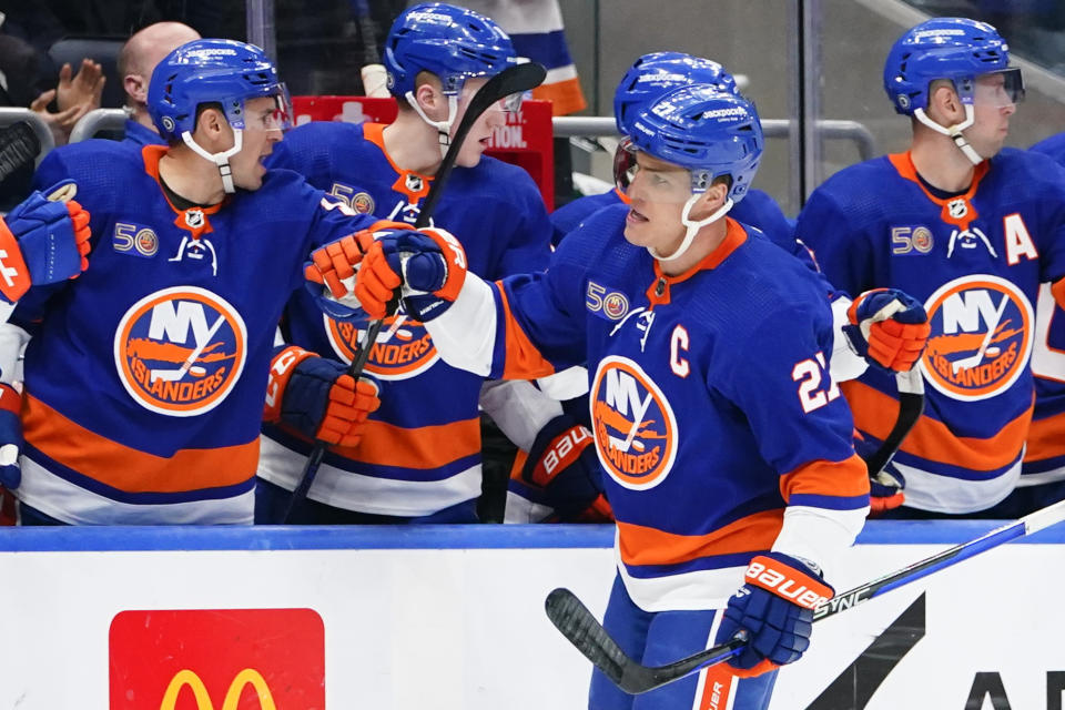 New York Islanders' Anders Lee celebrates with teammates after scoring a goal during the first period of an NHL hockey game against the Dallas Stars Tuesday, Jan. 10, 2023, in Elmont, N.Y. (AP Photo/Frank Franklin II)