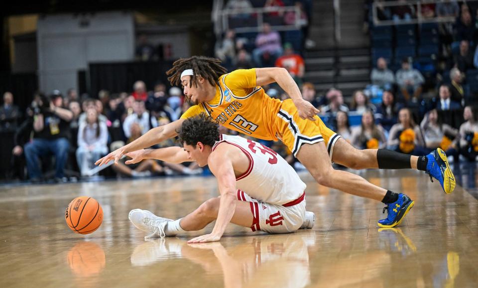 Kent State guard Jalen Sullinger (13) goes over Indiana guard Trey Galloway (32) during the second half of a NCAA Tournament game early Saturday, March 18, 2023, in Albany, N.Y.