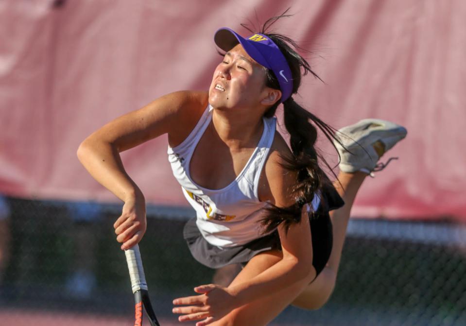 Wheeler's Miranda Ye serves in her match against LaSalle's Erin McCusker.

Wheeler School at LaSalle Academy -  With a win, team LaSalle reaches 100 straight games