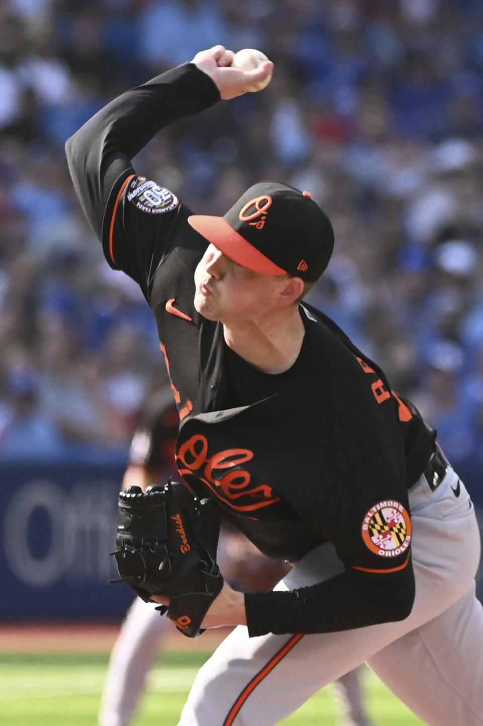Baltimore Orioles starting pitcher Kyle Bradish throws to a Toronto Blue Jays batter in first-inning baseball game action in Toronto, Saturday, Sept. 17, 2022. (Jon Blacker/The Canadian Press via AP)