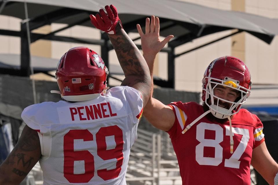 Kansas City Chiefs defensive tackle Mike Pennel Jr. (69) and Kansas City Chiefs tight end Travis Kelce (87) stretch during practice for Super Bowl 58 Thursday, Feb. 8, 2024 in Henderson, Nevada.