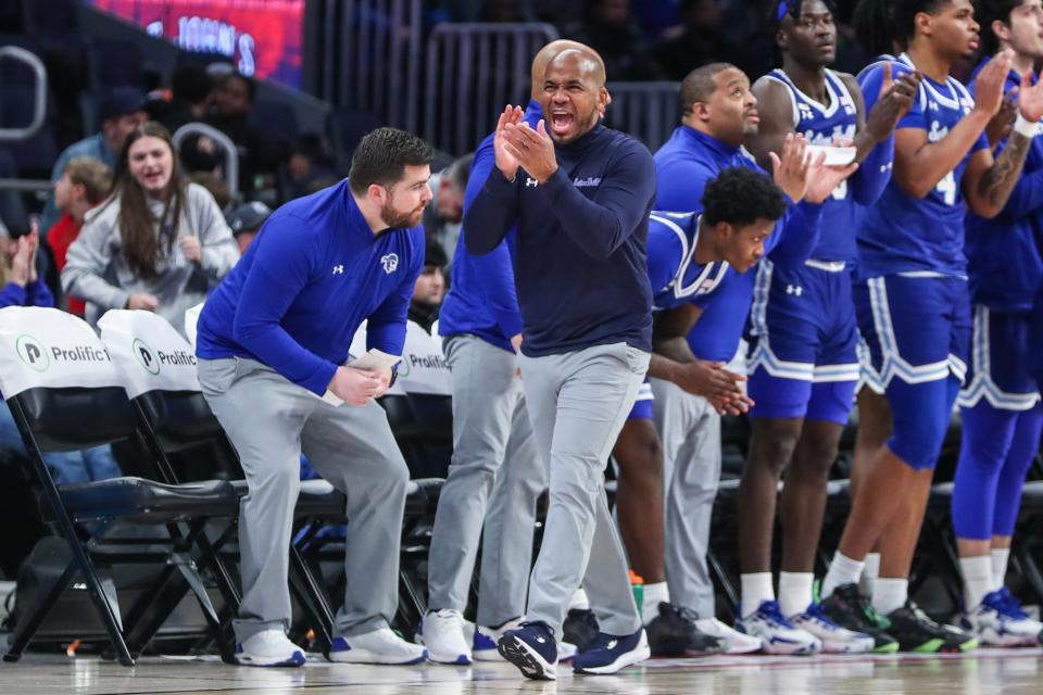 Feb 18, 2024; Elmont, New York, USA; Seton Hall Pirates head coach Shaheen Holloway celebrates in the first half against the St. John's Red Storm at UBS Arena. Mandatory Credit: Wendell Cruz-USA TODAY Sports