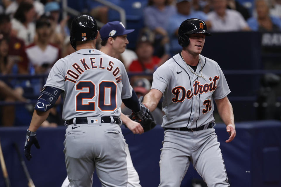 Detroit Tigers' Kerry Carpenter, right, celebrates with teammate Spencer Torkelson after scoring against the Tampa Bay Rays during the sixth inning of a baseball game Saturday, April 1, 2023, in St. Petersburg, Fla. (AP Photo/Scott Audette)