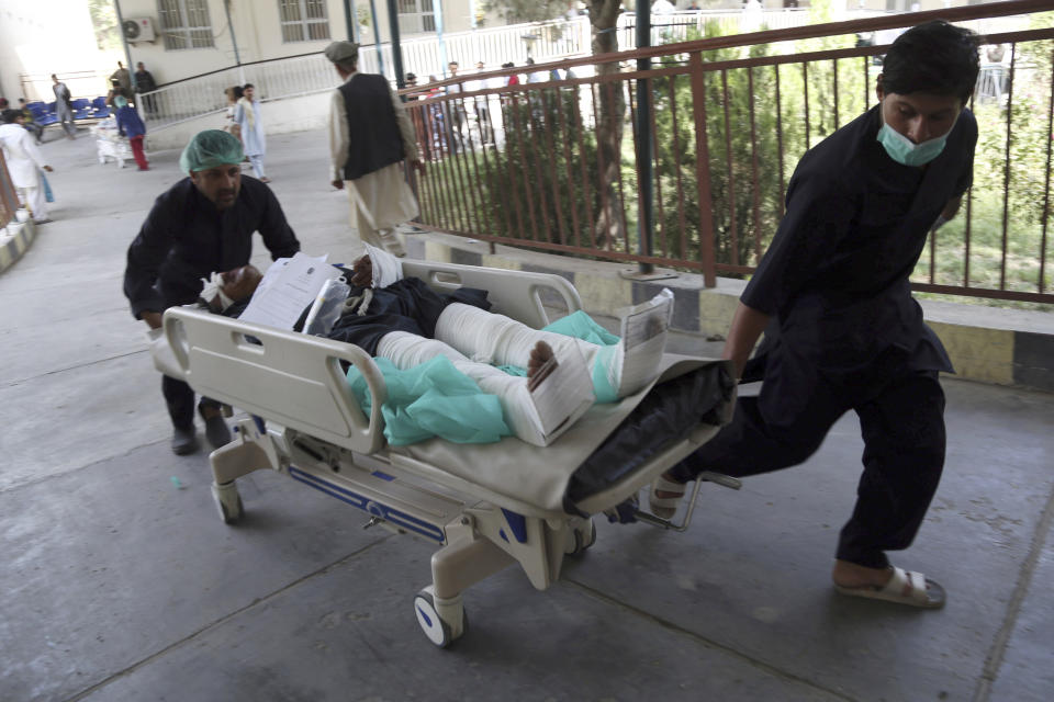 An injured man is carried into a hospital after a car bomb explosion in Kabul, Afghanistan, Thursday, Sept. 5, 2019. A car bomb rocked the Afghan capital on Thursday and smoke rose from a part of eastern Kabul near a neighborhood housing the U.S. Embassy, the NATO Resolute Support mission and other diplomatic missions. (AP Photo/Rahmat Gul)