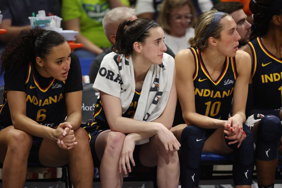 ARLINGTON, TEXAS - MAY 03: Caitlin Clark #22 of the Indiana Fever looks on from the bench while playing the Dallas Wings during a pre season game at College Park Center on May 03, 2024 in Arlington, Texas.