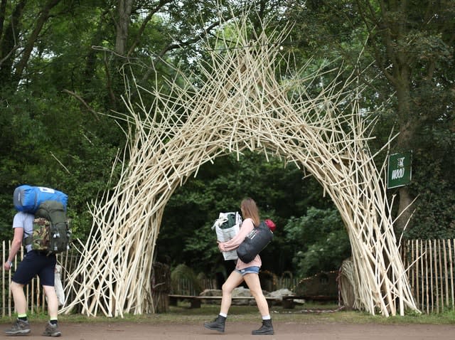 People arrive on the first day of Glastonbury Festival at Worthy Farm, Somerset 