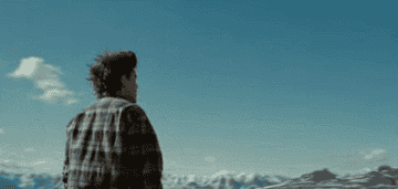 Emile Hirsch looking at a mountain view in "Into The Wild"