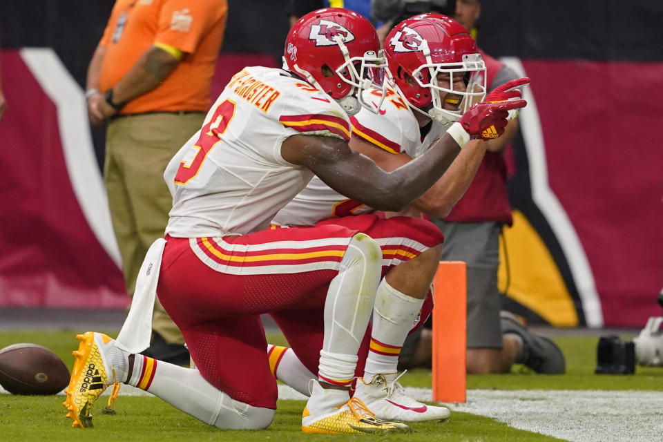 Kansas City Chiefs tight end Travis Kelce (87) and wide receiver JuJu Smith-Schuster (9) celebrate Kelce's touchdown against the Arizona Cardinals during the first half of an NFL football game, Sunday, Sept. 11, 2022, in Glendale, Ariz. (AP Photo/Matt York)