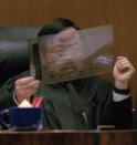 <p>Judge Lance Ito holds up a sample of a DNA sequence during the trial. The prosecution built its case largely around DNA evidence they said linked O.J. Simpson to the crime scene. But the defense raised questions about the reliability of the blood evidence; arguing it had been mishandled by police. (Photo: John McCoy/AP) </p>