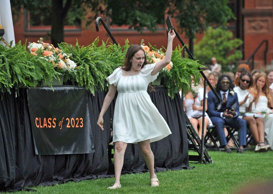 Morgan Spriggs looks to her family after receiving her diploma during the Thayer Academy commencement in Braintree on Saturday, June 10, 2023.