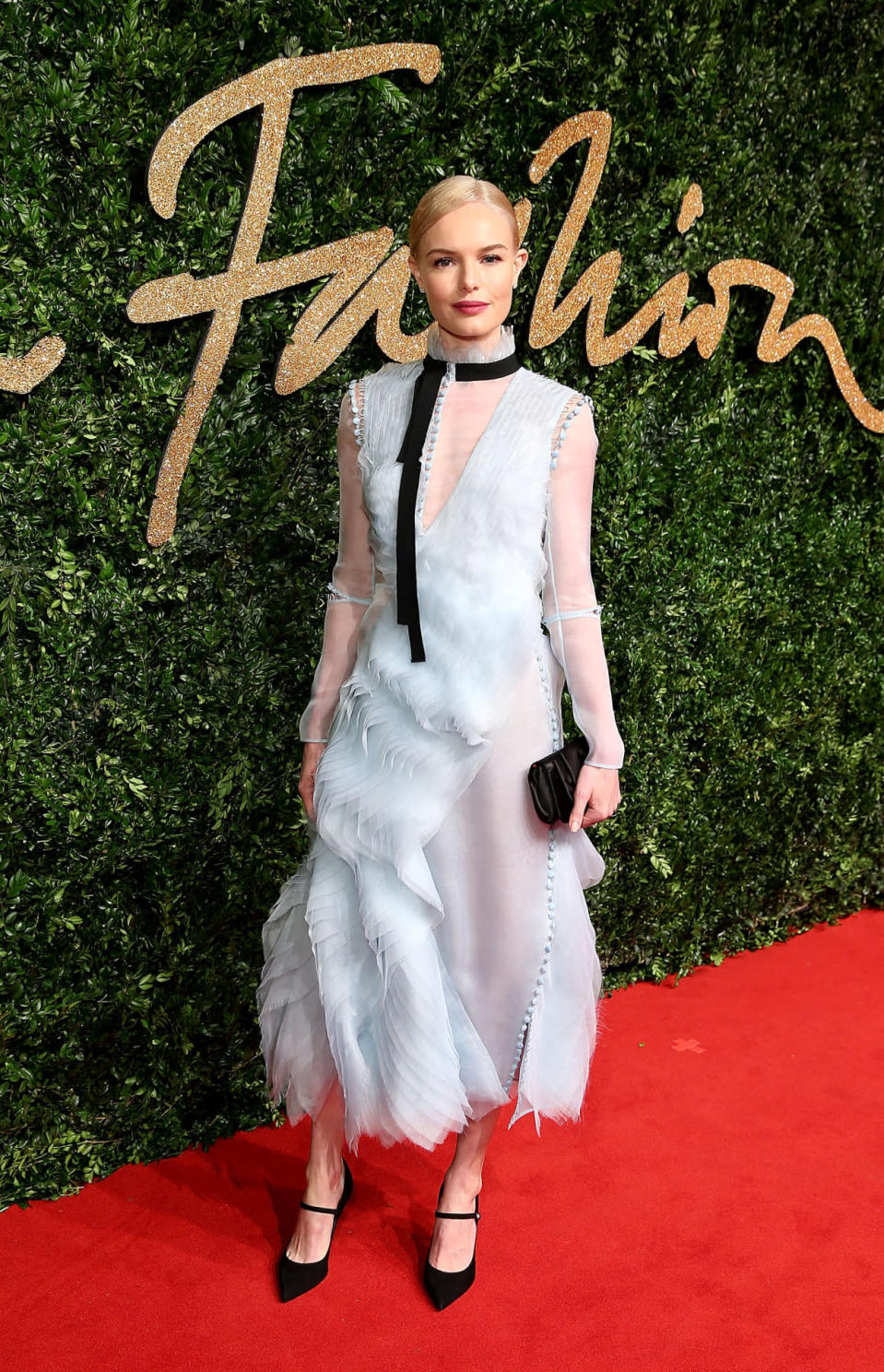 Kate Bosworth in a light blue frock with high neck and ribbon detail by Erdem.