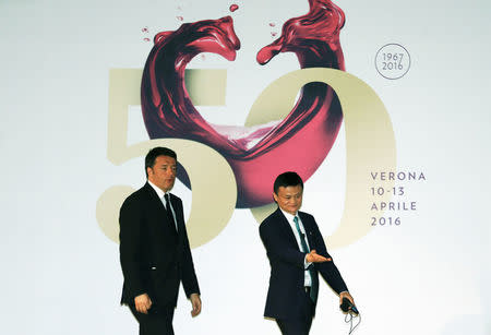 Founder and Executive Chairman of Alibaba Group Jack Ma (R) and Italy's Prime Minister Matteo Renzi (L) arrive at the Vinitaly wine exhibition in Verona, Italy, April 11 2016. REUTERS/Stefano Rellandini