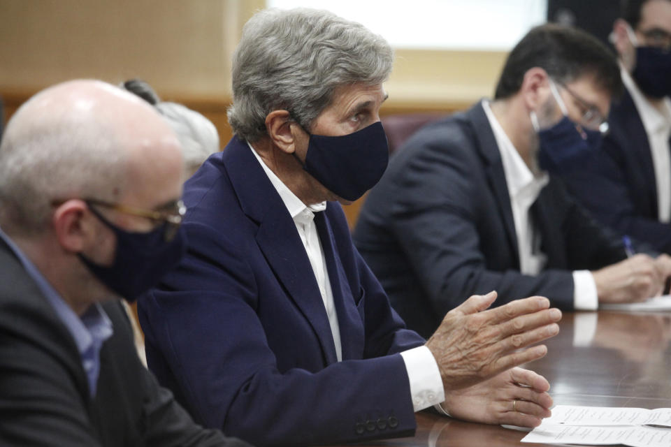 U.S. Special Presidential Envoy for Climate John Kerry, second from left, speaks during a meeting with Japanese Environment Minister Shinjiro Koizumi at the latter's office in Tokyo, Tuesday, Aug. 31, 2021. Kerry was in Tokyo to discuss efforts to fight climate change with top Japanese officials ahead of a United Nations conference in November. (AP Photo/Koji Sasahara, Pool)